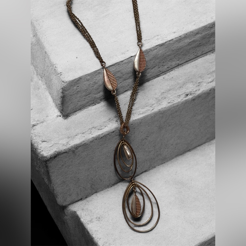 Gold and rose  gold metal necklace with leaf design